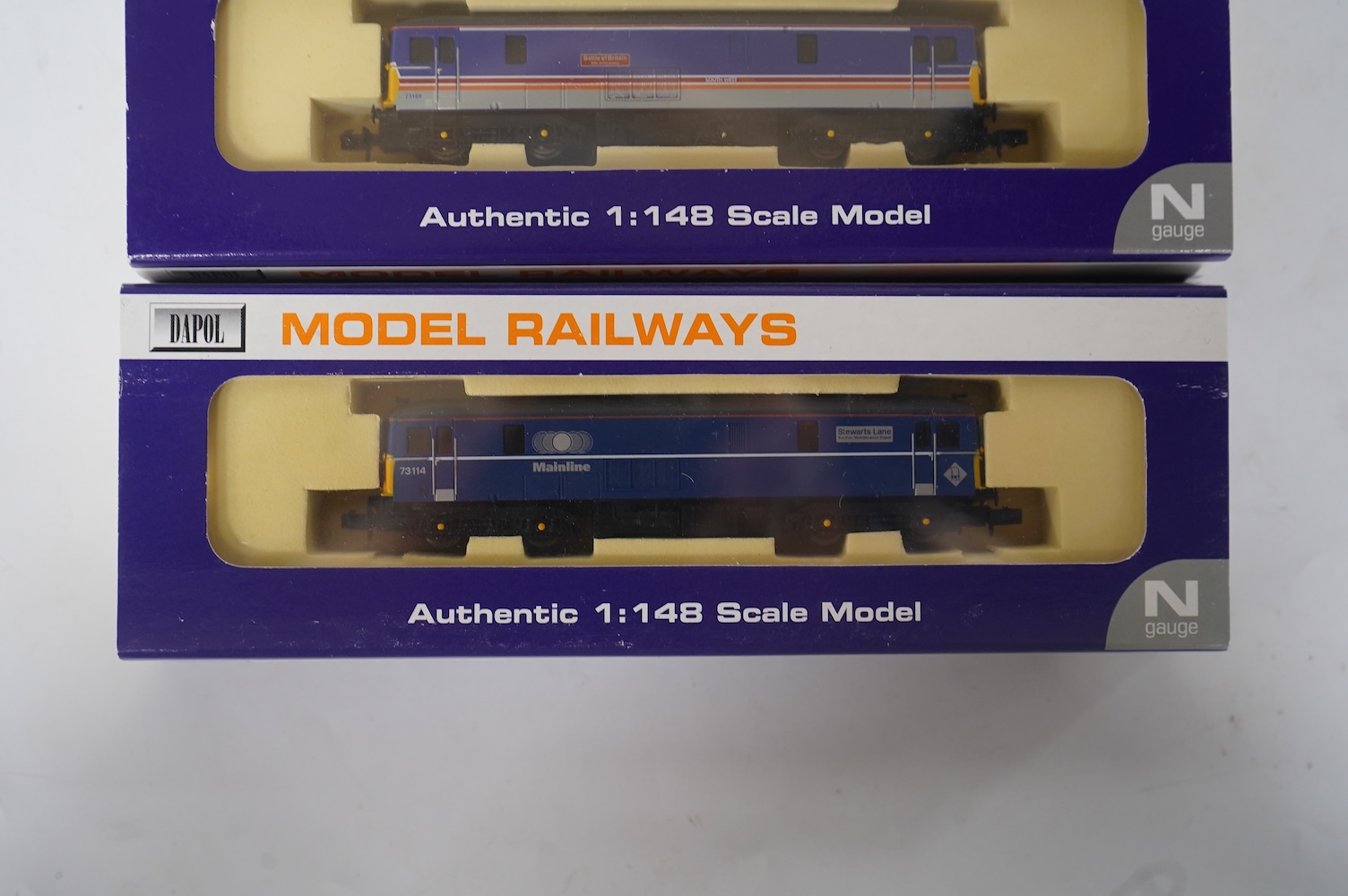 Three boxed Dapol N gauge railway Class 73 electro-diesel locomotives; 73109 Battle of Britain (ND006), 73114 Stewarts Lane (ND-021a) and 73134 Woking Homes (ND-007). Condition - good.